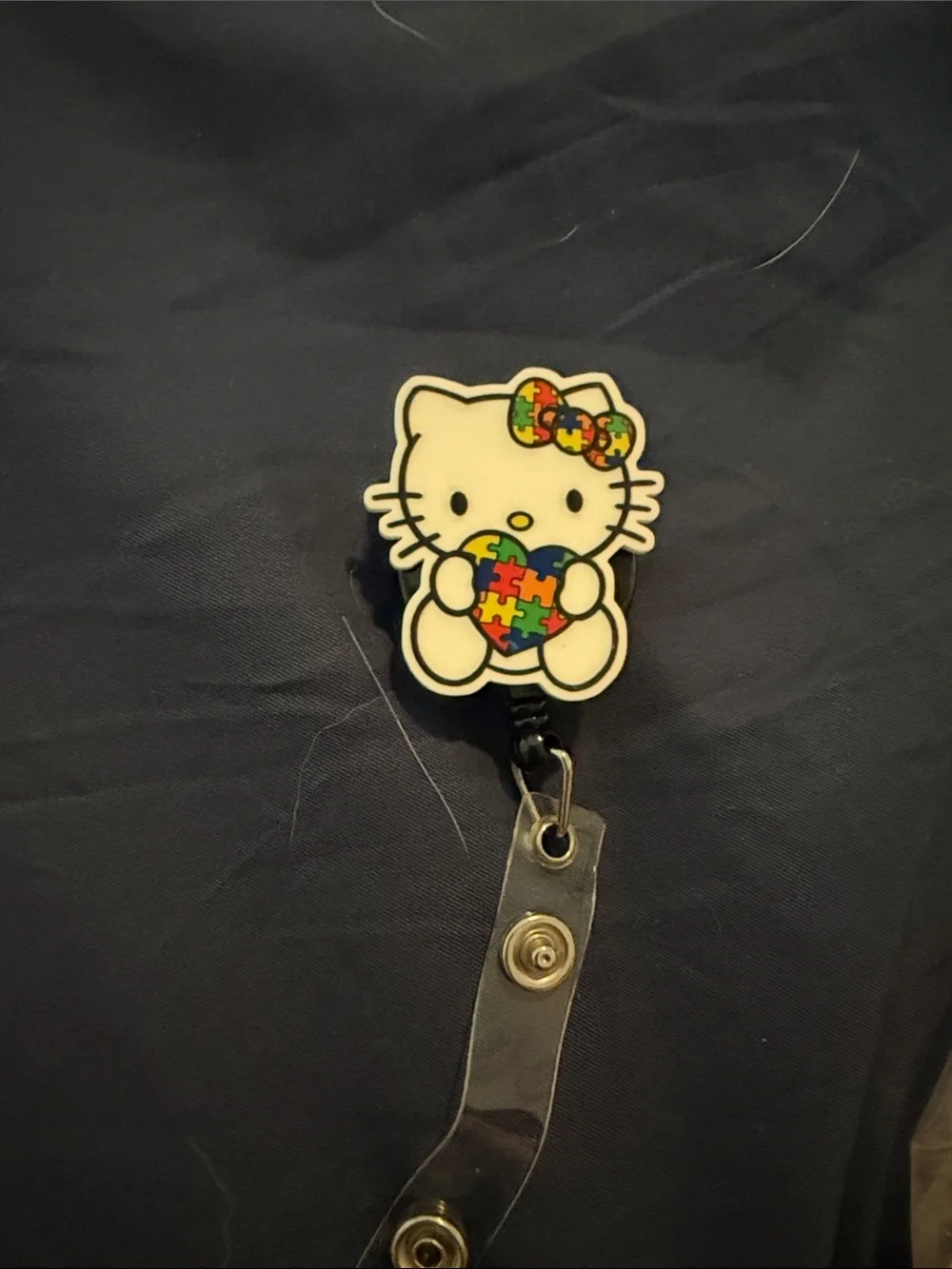 Hello Kitty White Badge Reel with Multicolor Puzzle Heart